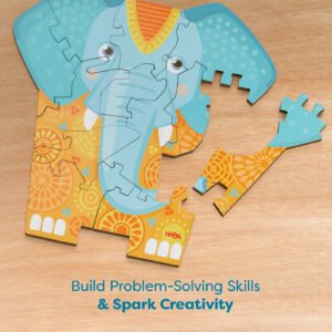 Elephant-shaped jigsaw puzzle with colorful patterns on a wooden surface.
Text reads 