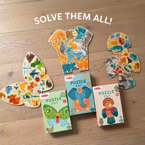 HABA Butterfly, Elephant, and Parrot 2-in-1 Wooden Puzzles put together with each box on a table and the text 