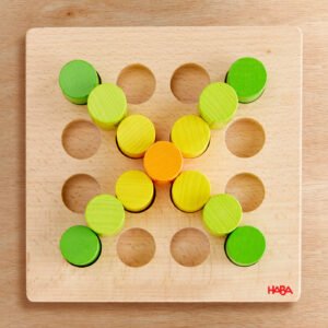 A wooden pegboard with colorful pegs arranged in an X shape.